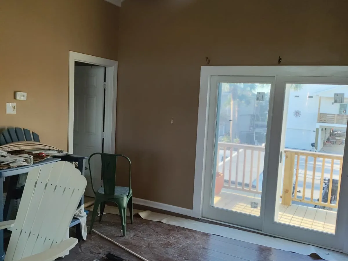 Interior room with a newly installed sliding glass patio door